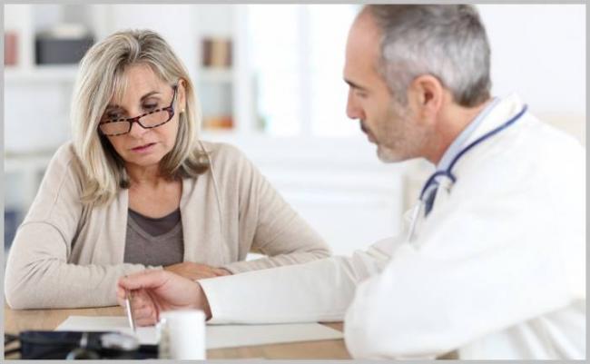 2018-07-08-Doctor-and-female-patient-Managed-Care.jpeg